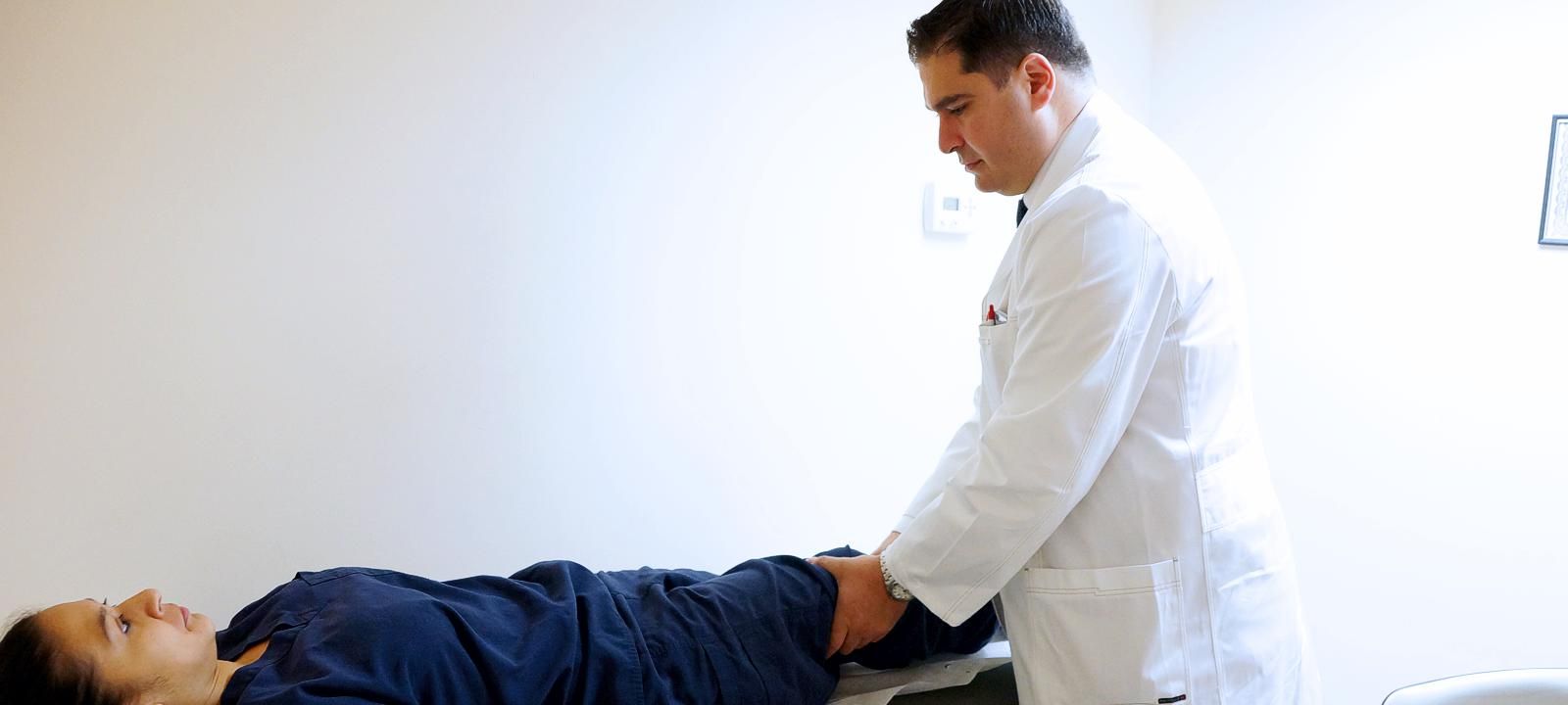 Neofitos Stefanides examines a patient